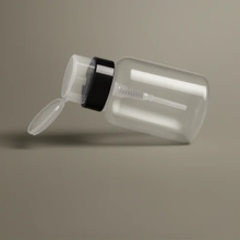Clear plastic container with a black band on a gray background