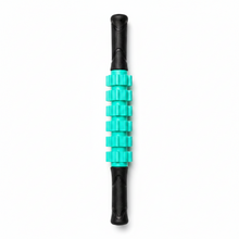 A vertical massage roller with textured black handles and a central section of bright turquoise green knurled rollers, shown on a neutral gray background.