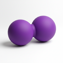 Two purple exercise balls on a brown background