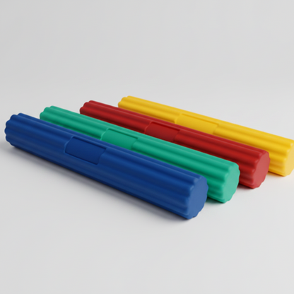 Set of colorful foam rollers on a brown background