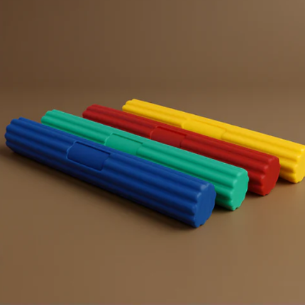 Set of colorful foam rollers on a brown background